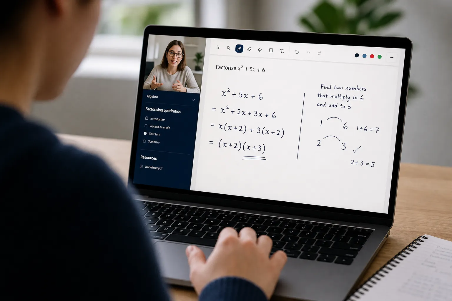 Over-the-shoulder view of a live one-to-one online tutoring lesson on a laptop whiteboard